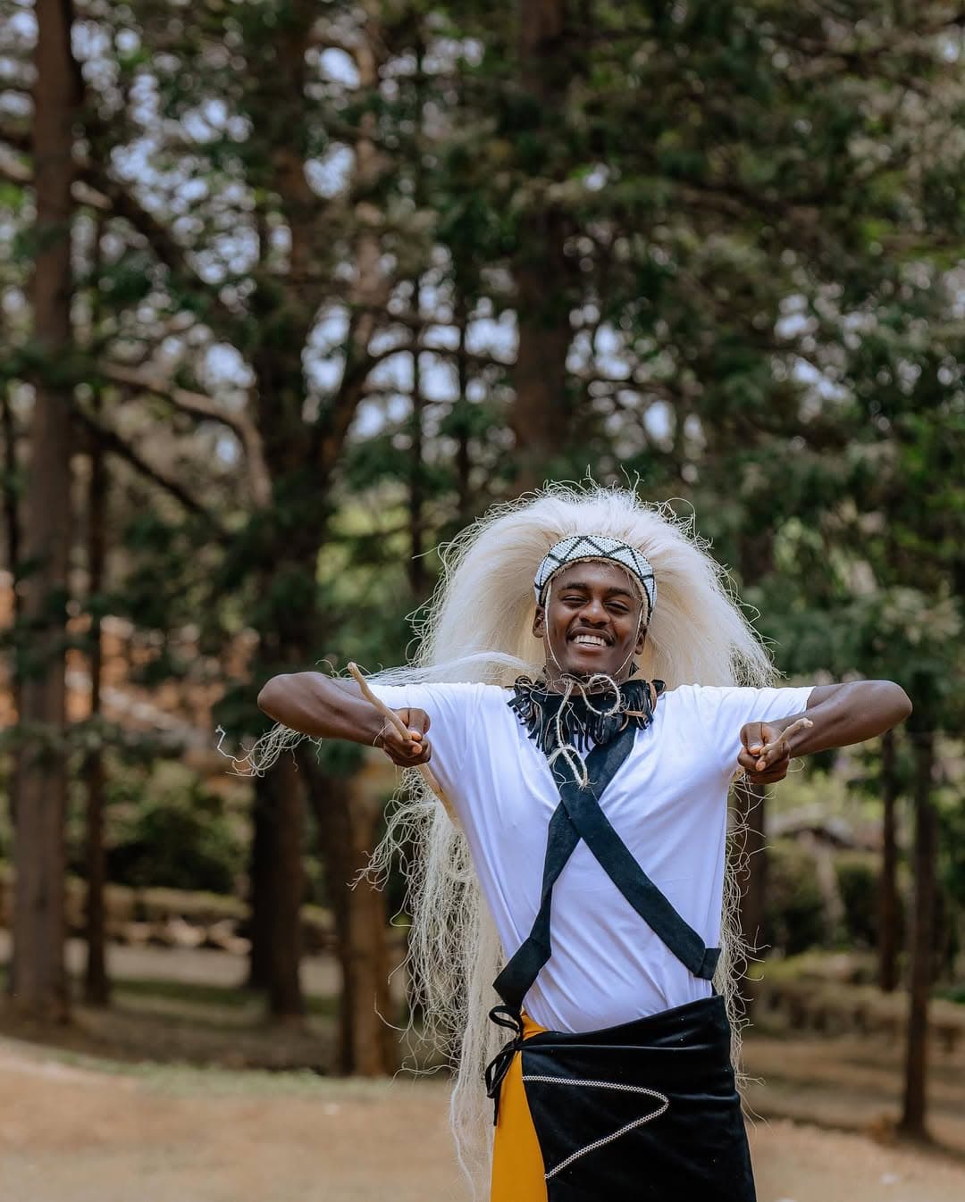 Corporate team learning Rwandan cultural traditions